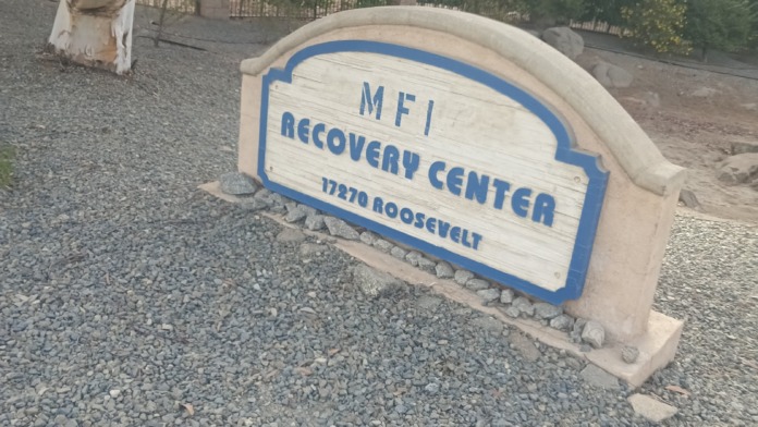 Exterior signage for MFI Recovery Center at 17270 Roosevelt with landscaped grounds and trees