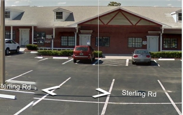 Exterior view of treatment facility parking area on Sterling Road with building visible in background