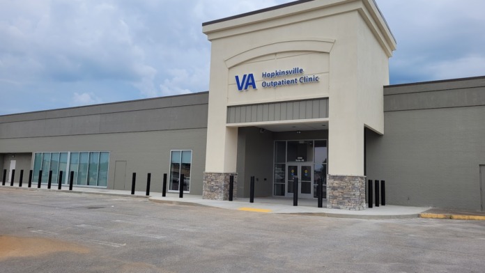 Exterior entrance showing Suite 4G address identification and automatic door signage