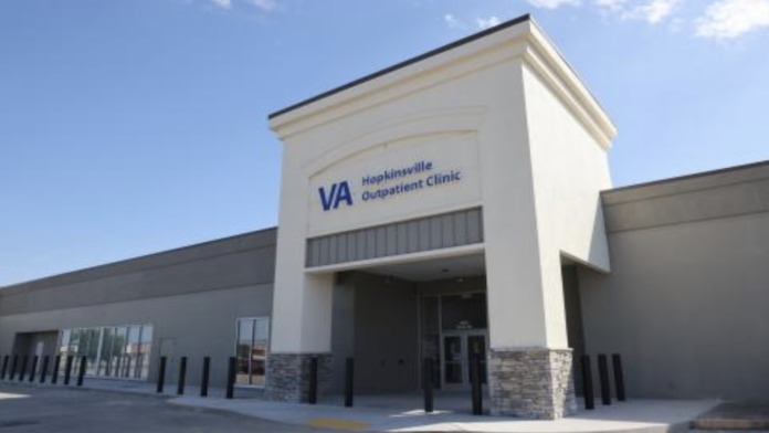 Exterior view of Hopkinsville VA Clinic main entrance with glass doors, large windows, and welcoming signage
