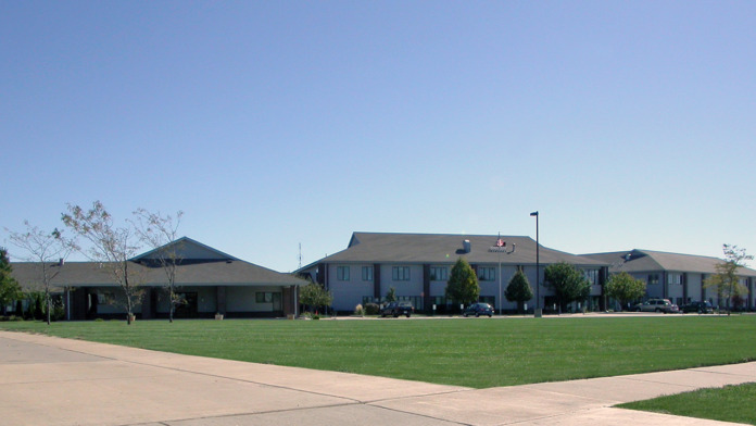 Exterior view of Chestnut Health Systems Joliet treatment center showing main building facade, landscaped grounds, and parking area