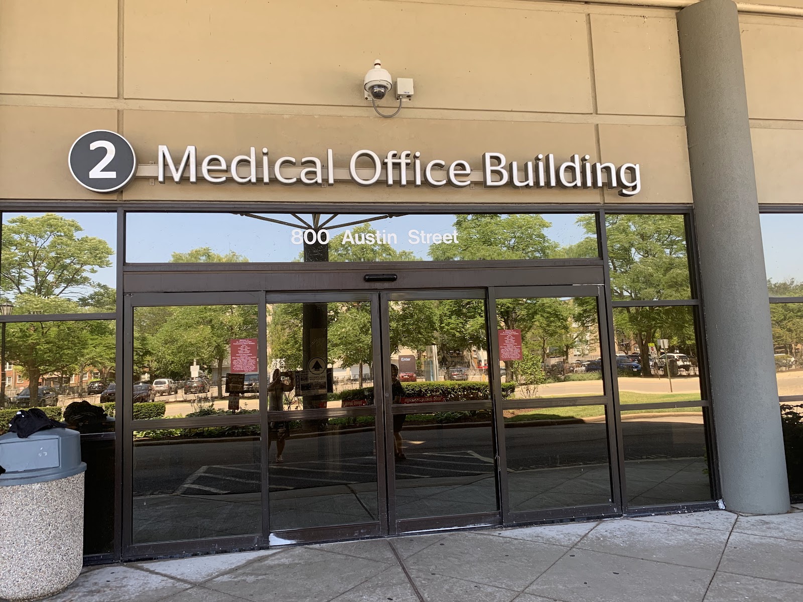 Interior building entrance showing directional signage for Medical Office Building at 800 Austin Street with glass doors