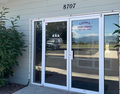 Exterior showing address 8707 and glass doors with Community Medical Services logo branding displayed