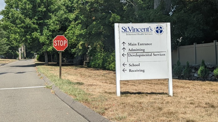 Directional sign for St. Vincent's Behavioral Health Services with arrows for departments and services.