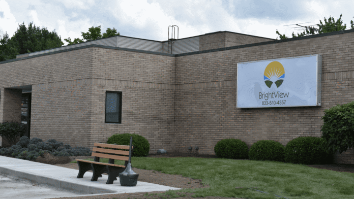 Exterior brick treatment facility showing main entrance with BrightView logo, landscaped grounds, and clear signage.
