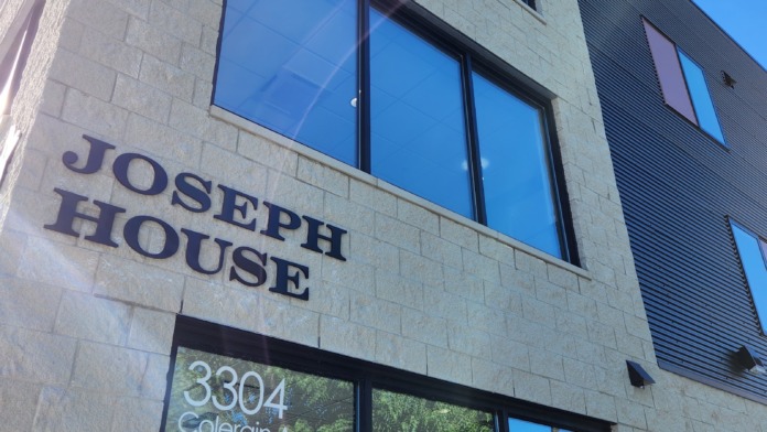 Exterior corner of Joseph House showing facility name, street address 3304 Colerain Avenue, modern stone and metal facade