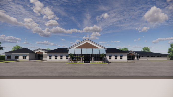 Exterior rendering of modern wellness facility with white brick facade, central entrance pavilion, and landscaped grounds