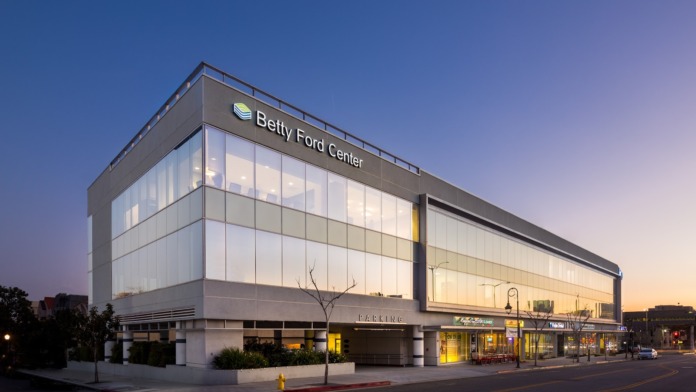 Exterior of Betty Ford Center outpatient facility at dusk showing modern glass storefront and illuminated signage