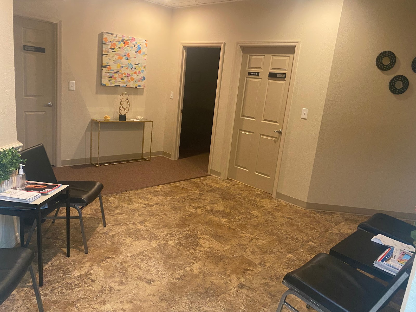 Interior reception area with seating, service counter, door access, and professional furnishings