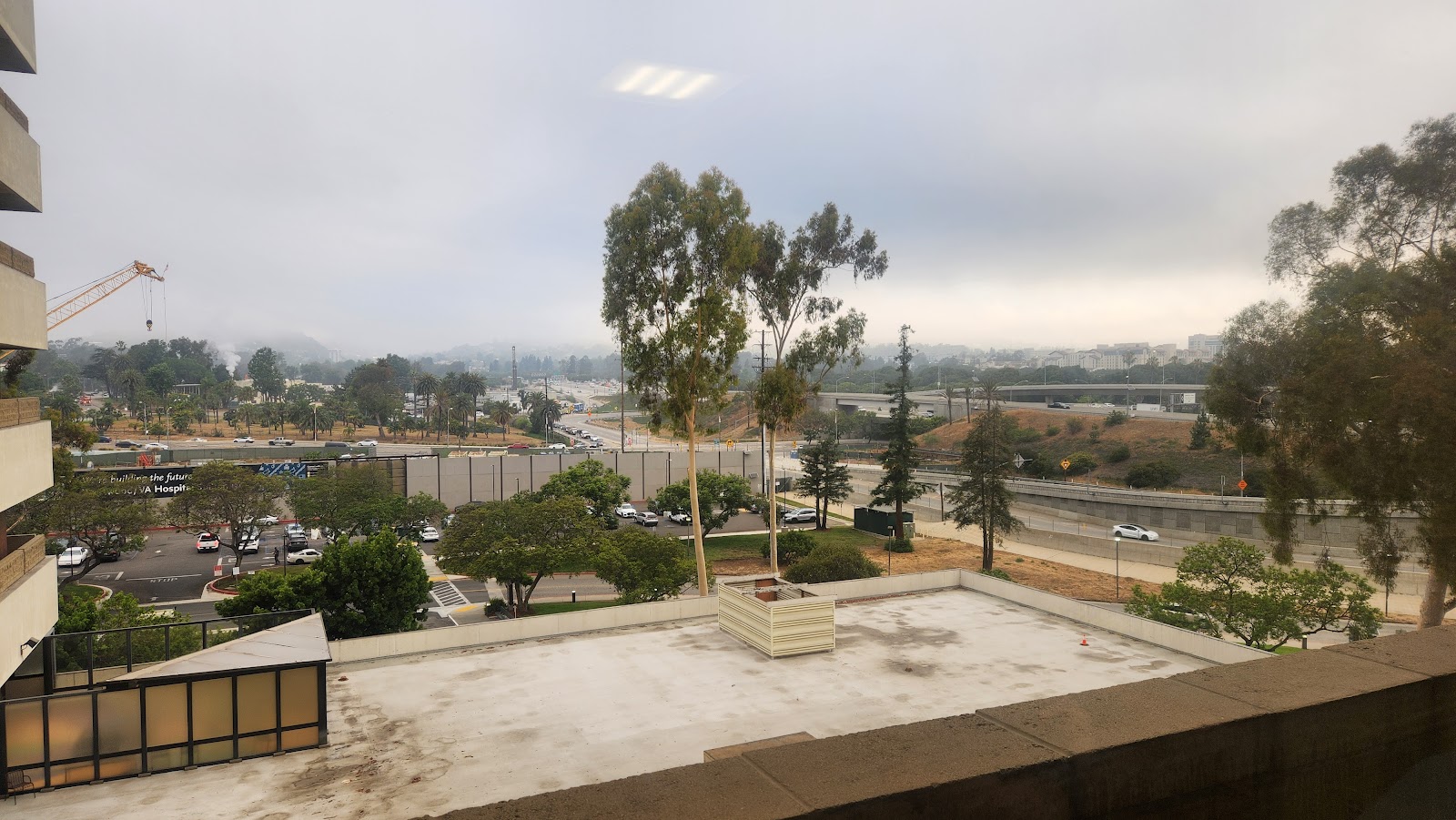 Elevated rooftop area with seating and expansive views of facility grounds and surrounding landscape
